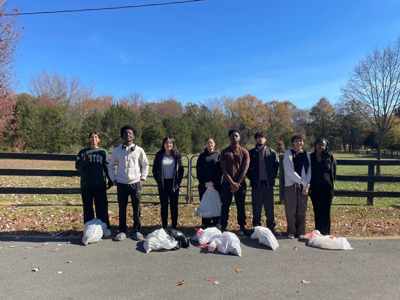 LNCP volunteers with collected trash bags at the end of a cleanup