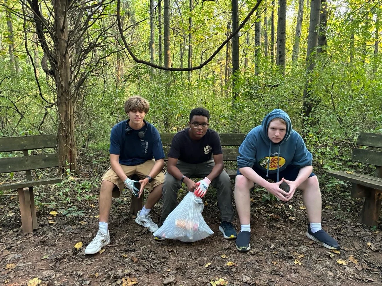 Three LNCP volunteers working outdoors