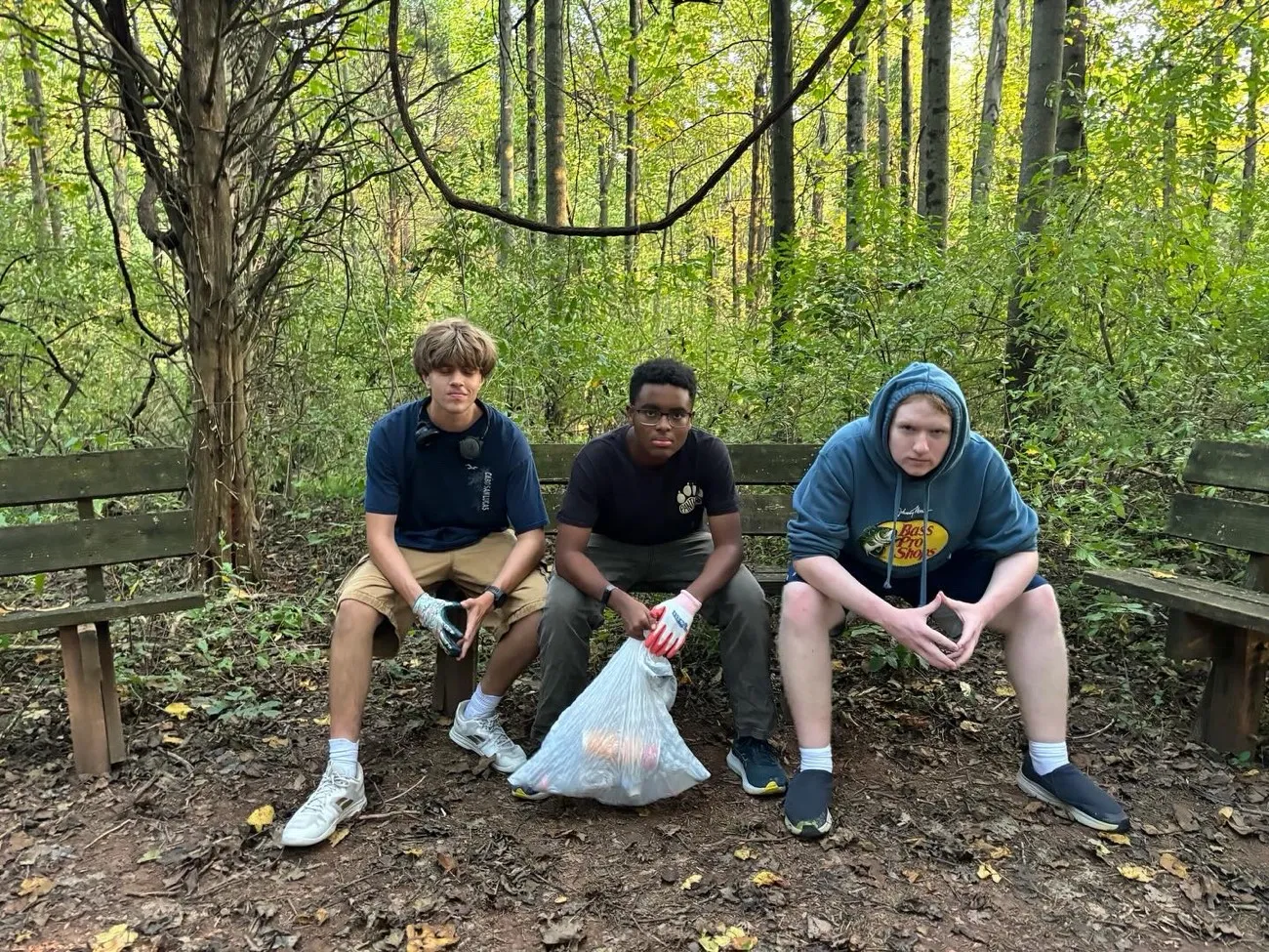 Three LNCP volunteers working outdoors